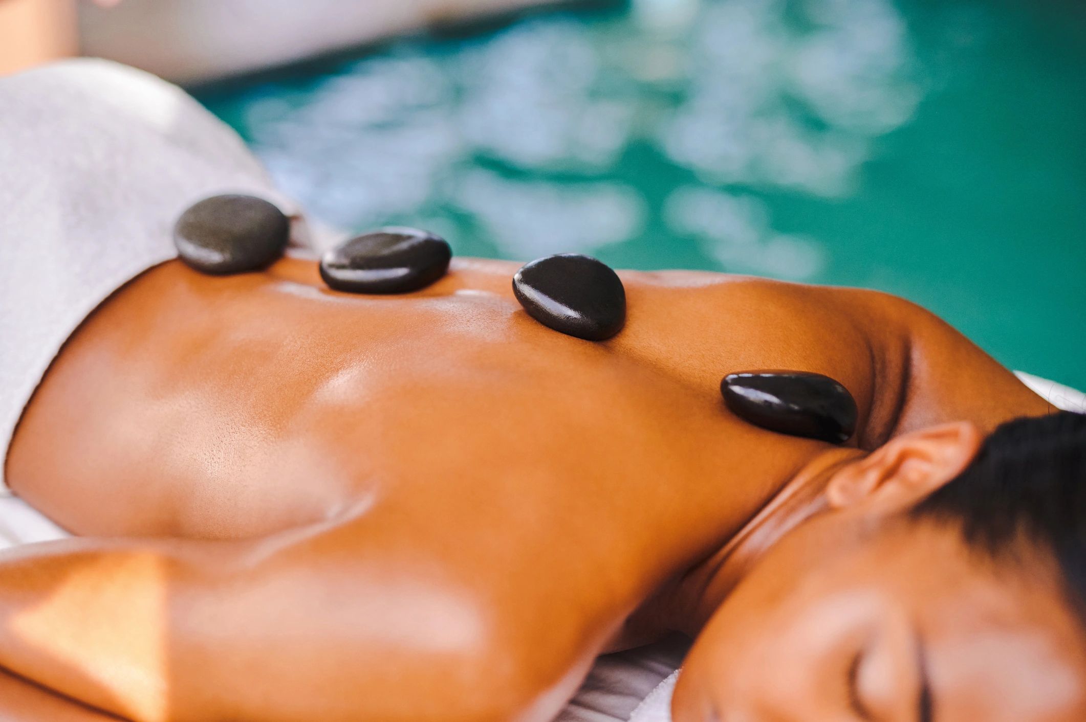 Massage therapy session with hot stones