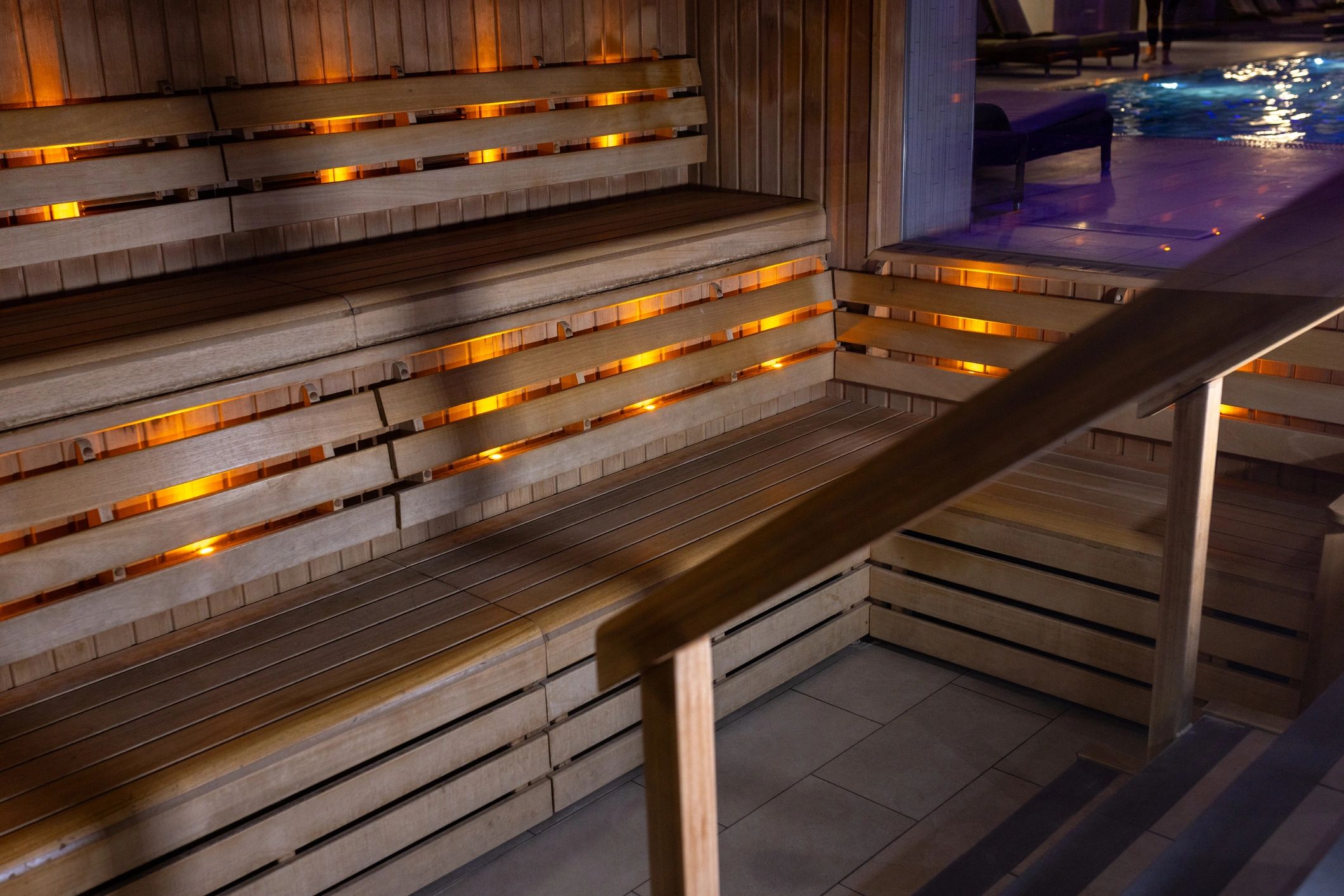 Calm sauna and bath area with warm wood finishes