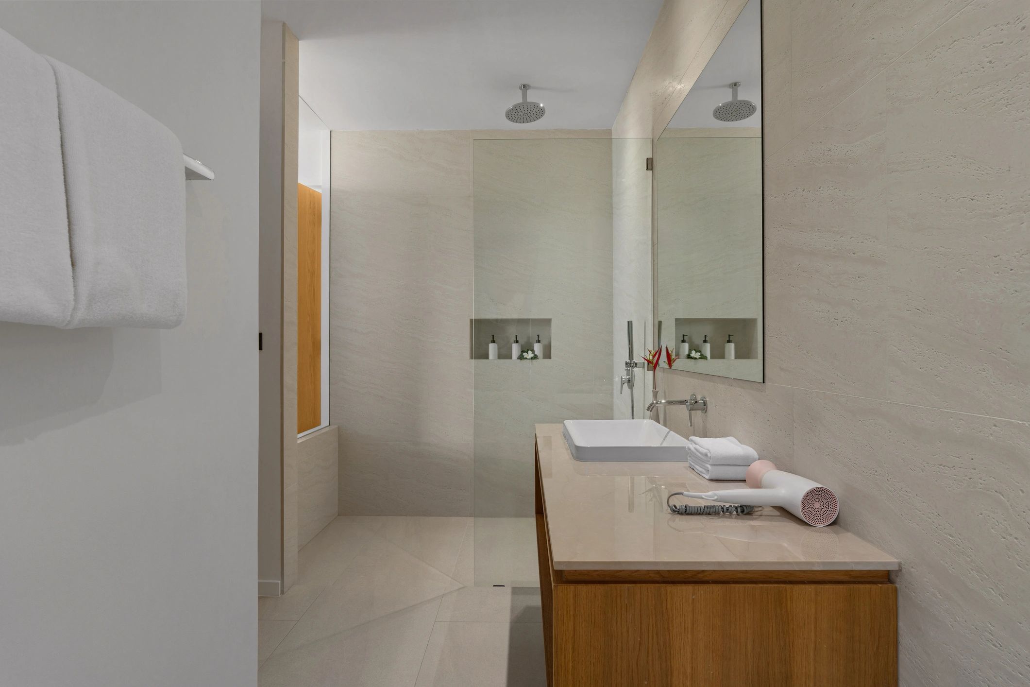 Minimalist bath area with modern fixtures and spa-like design